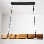 Vintage wood pendant light hangs on the pure white ceiling