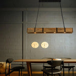 The Vintage Wood Pendant Lamp is hung on the dining table, and the scene is a retro canteen.