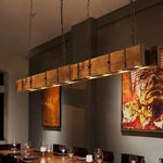 The vintage wood pendant light is very suitable for the industrial-style restaurant